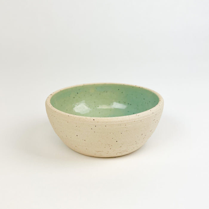 Chibiko bowl in seafoam glaze. Natural stoneware hand crafted in Hawaii by Tamiko Claire Studio. Its small proportions make it perfect for a serving of gelato or holding tiny treasures. Measures 4" diameter 2.5" height.