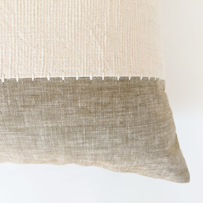 Close up detail of the cream colored stitching on the tan and cream color block panels. Hamptons Pillow.