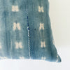 Close up detail of vertical hand mending in cobalt and white thread on pattern "shibori 2.0", square Zola pillow.