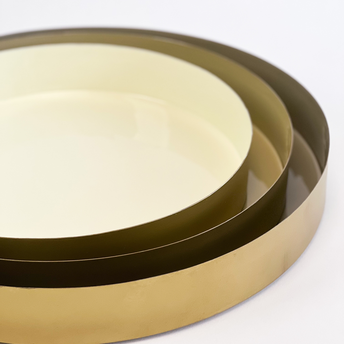 Sonoma brass trays make a sleek decorative accent in any neutral room. Three nesting trays each with a complimentary neutral enamel interior. Each tray sold separately.