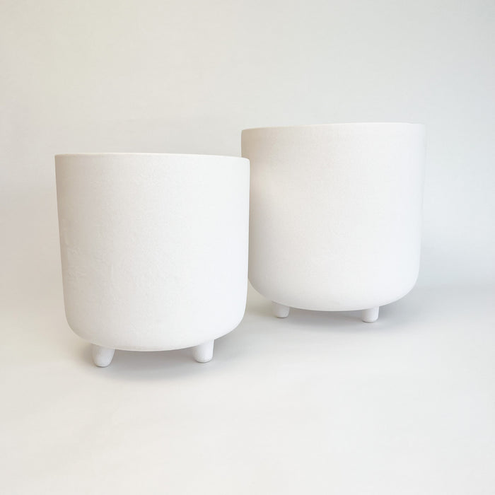 Adobe footed vessels. Ceramic pots finished with a matte white glaze resembling adobe. Perfect for adding modern  Mediterranean or boho chic style to your room or patio. Small and medium available, each sold separately. 