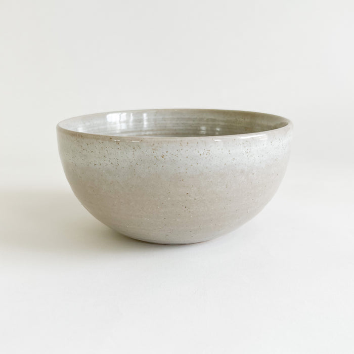 Stoneware Bayside bowl. Finished in a soft grey glaze with sandy speckles showing through. The perfect breakfast bowl for the coastal table. 5.75" diameter, 2.75" height.
