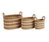 Coastal stripe storage baskets shown in large, medium and small sizes. Each sold separately. Woven in natural seagrass with three white stripes. Oval shape with handles on each side.