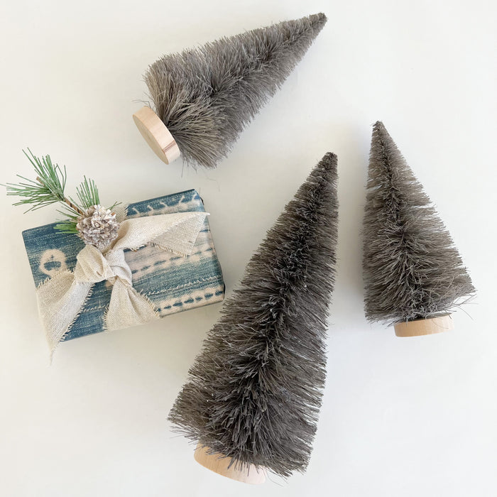 Grey bottle brush trees with natural wood base. 6" small and 9" medium.