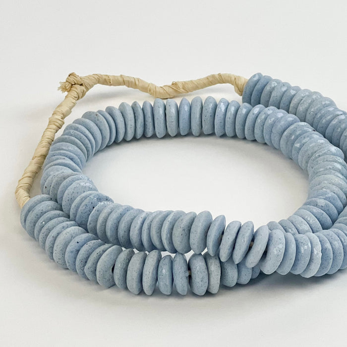 Our surf blue ashanti beads are handcrafted using traditional techniques in Ghana. A beautiful accent for the coastal home. Approximately 26" length.