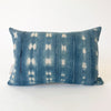 Small Zola pillow in shibori pattern 2.5. Faded indigo and natural shibori "tie dye" pattern with vertical mending stitches in eggplant and light blue. Natural Belgian linen back. Measures 19" x 13". Limited edition.