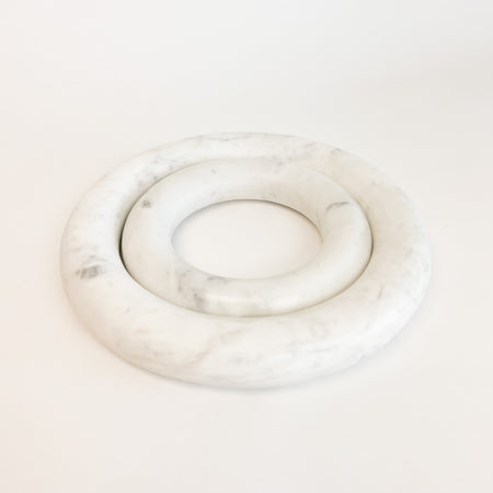 Set of 2 white marble trivets with grey veins. A chic way to protect surfaces from heat or pans. A great accent for any modern or classic kitchen. Set of 2 includes one small 5.5" and one  large 8" diameter ring.