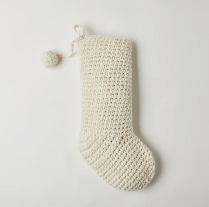 Hand knit ivory wool Christmas stocking with small pom and hanger loop. 20 inches long, 6 inches wides. Hand crocheted in the U.S.A.
