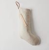 Oatmeal linen Christmas stocking with cotton lining. Natural leather hanger loop. Hand stamped leather tag with "Fa La La".