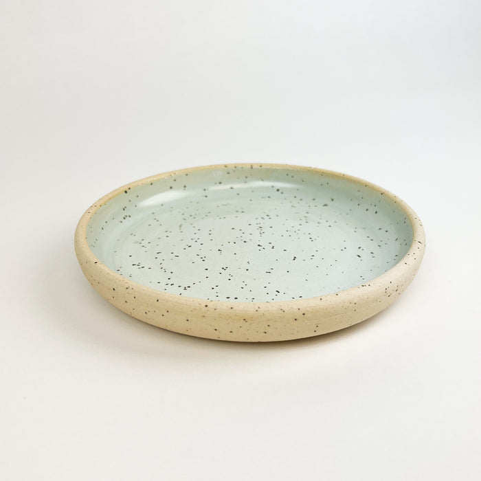 Momo dish in the sea mist glaze. Artisan stoneware from Tamiko Claire's studio in Hawaii. Perfect as a jewelry or trinket dish. Measures 6.25" diameter 1" height.