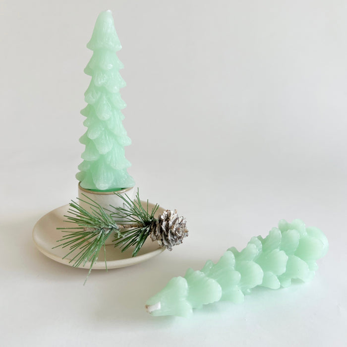 Tree shaped wax taper candles in mint green color. Set of 2 comes in Kraft box ready for gifting. Unscented. 5" length.
