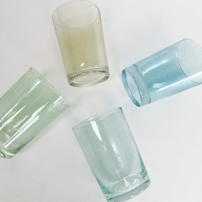 Bubble glass drinking glasses in 4 shades of coastal inspired colors. Seagrass, turquoise, verde and amber. Each sold separately.
