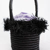 Mini basket bag with raffia pom poms in black
