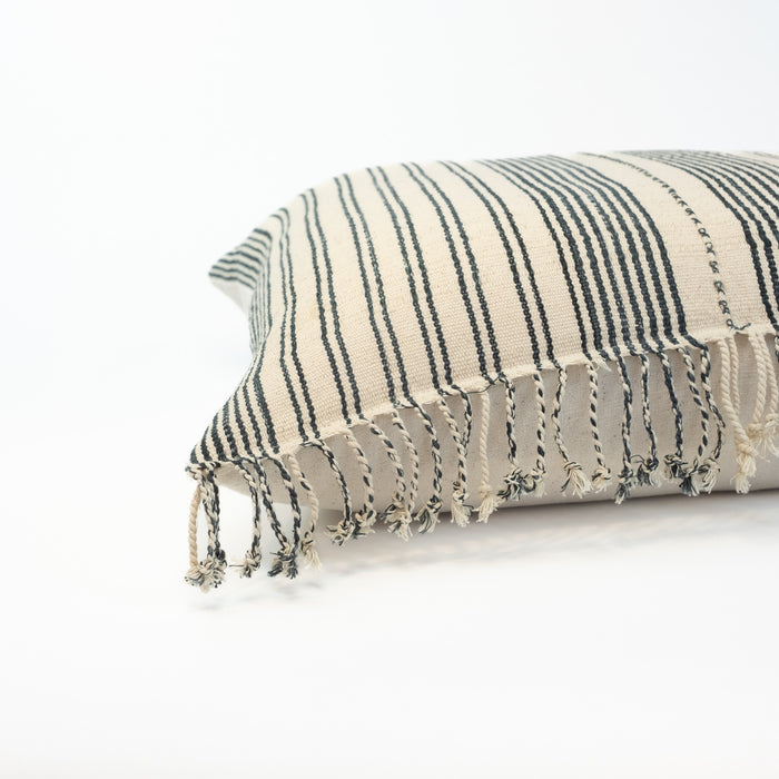 Luna Pillowcover, one of a kind finished with hand twisted fringe on one side. Made from vintage tribal fabric in ecru and rich indigo stripes. Perfect for the modern coastal home. Measures 20” x 20”. Insert NOT included.