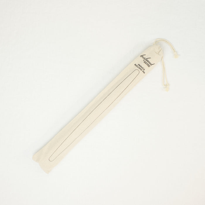 French rolling pin shown in natural canvas pouch.