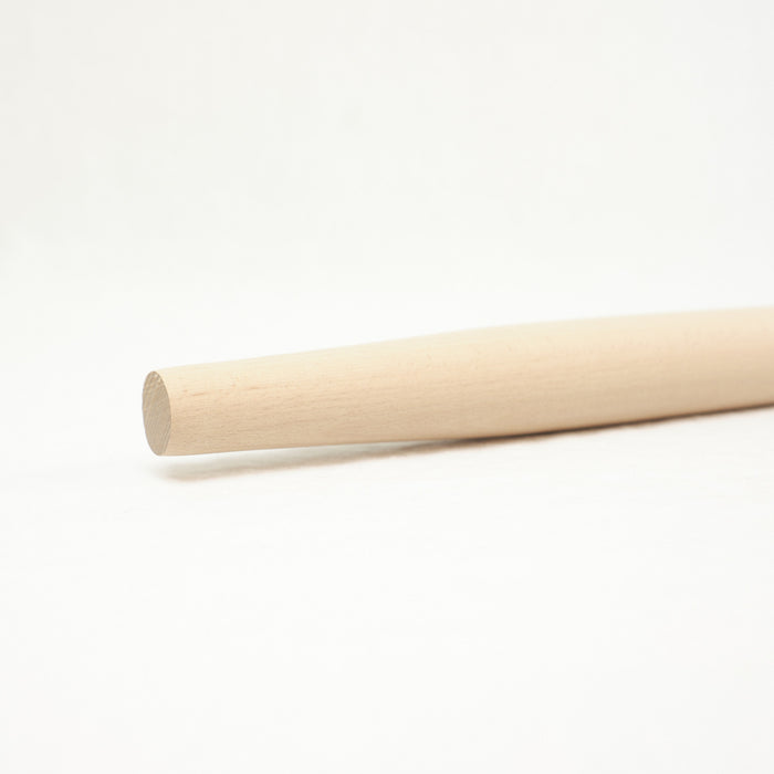 Close up of French wood rolling pin in natural wood.