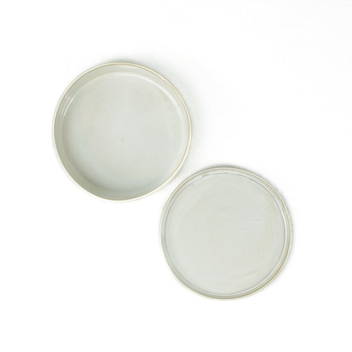 Round ceramic serving dish and plate in a grey-white glaze. Made in Thailand by Yarnnakan studio.