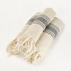 hand loomed linen towel in ecru with black stripes and fringe trim